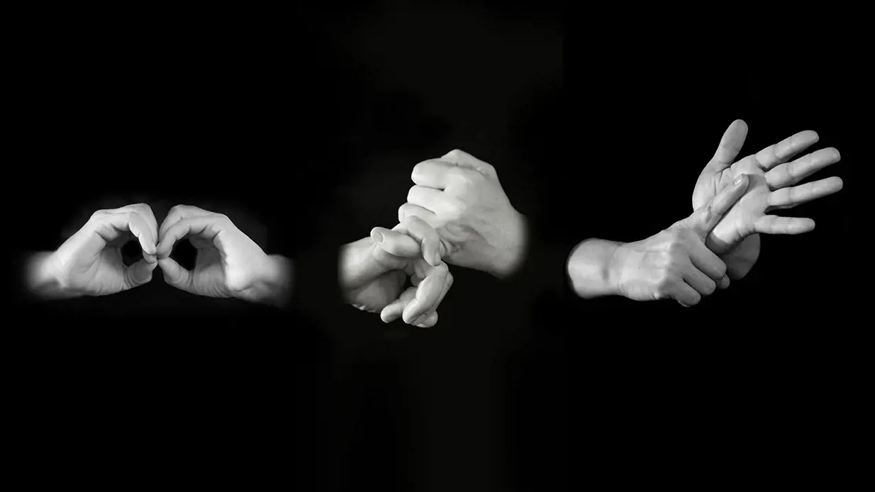 Black and white photo using sign language. 