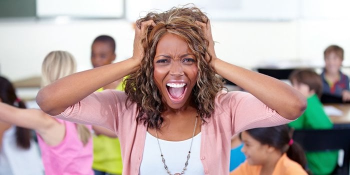 Teacher screaming in front of a class