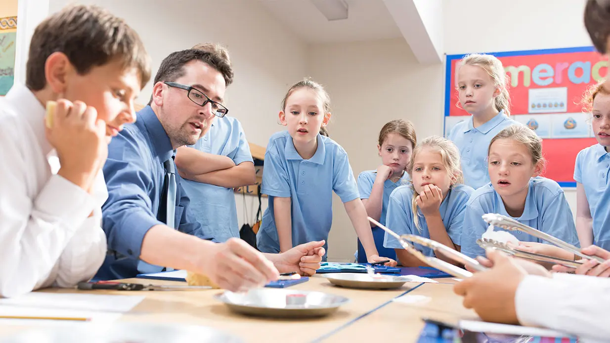 Primary Students watching a teachers demonstration