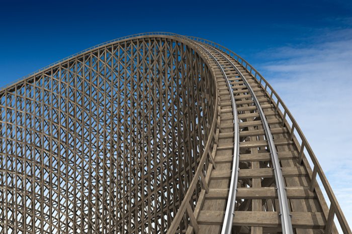 Rollercoaster hill against blue sky