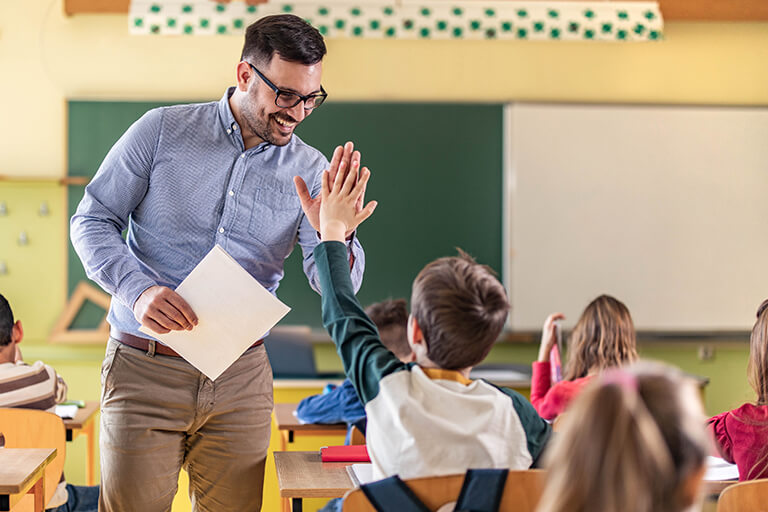 Teacher student high five