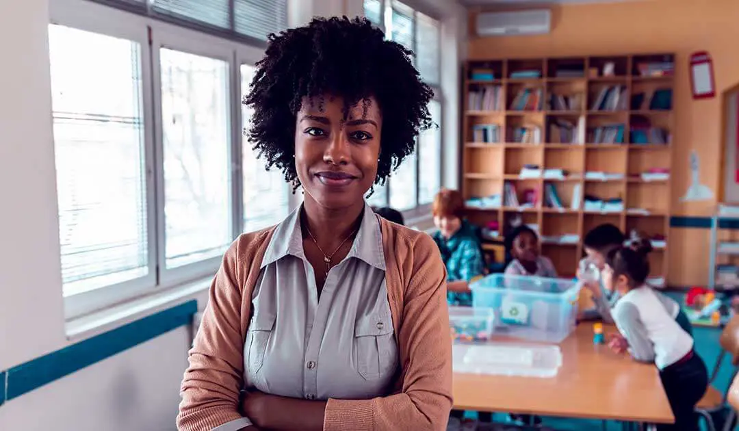 Female teacher arms crossed looking into the camera