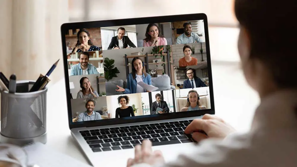 Laptop screen showing the participants of a virtual meeting.