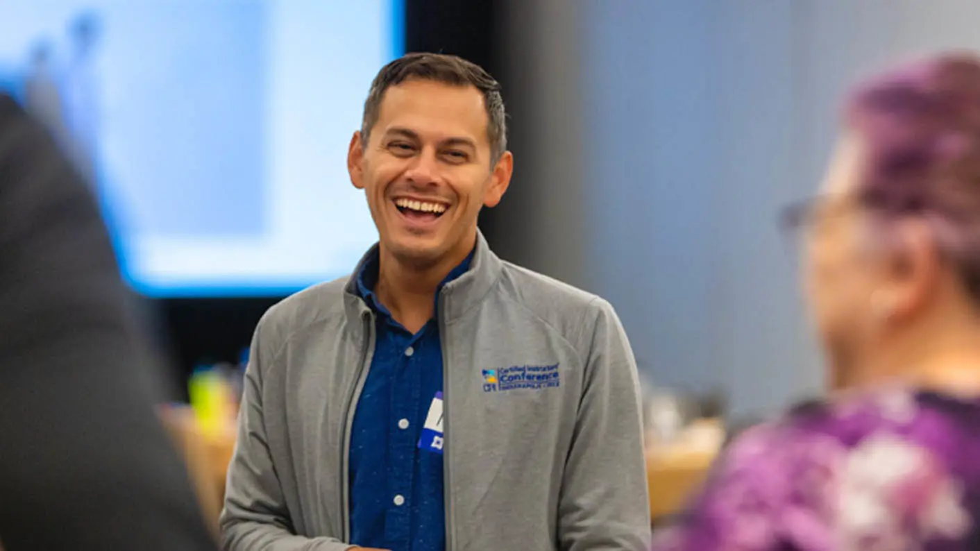 A smiling man wearing CPI clothing.