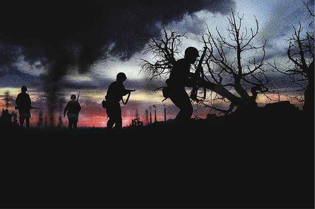 Solders in field at twilight